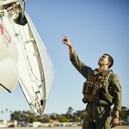 Des inspecting the front of the plane