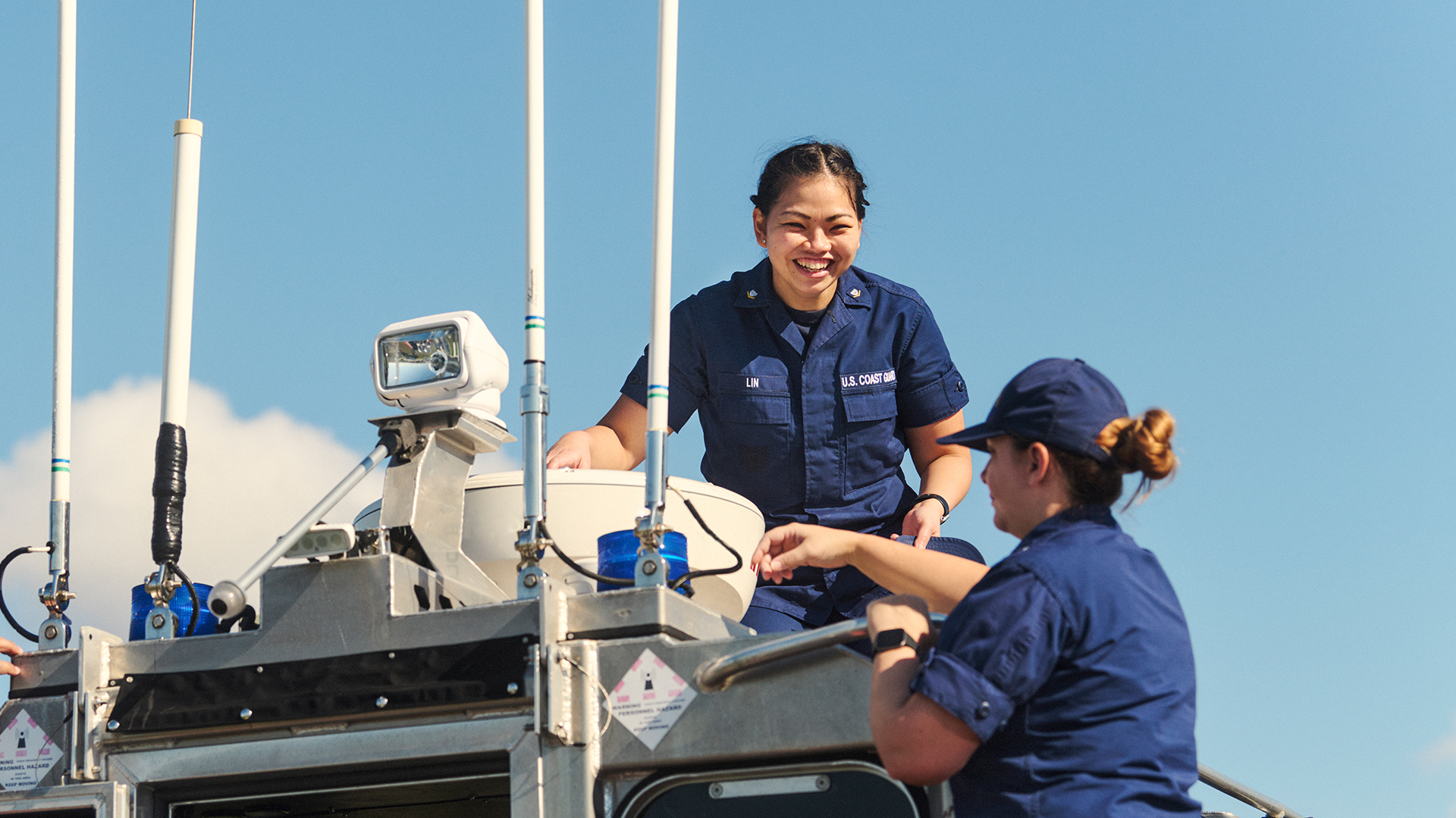 Aeint Lin on top of a boat