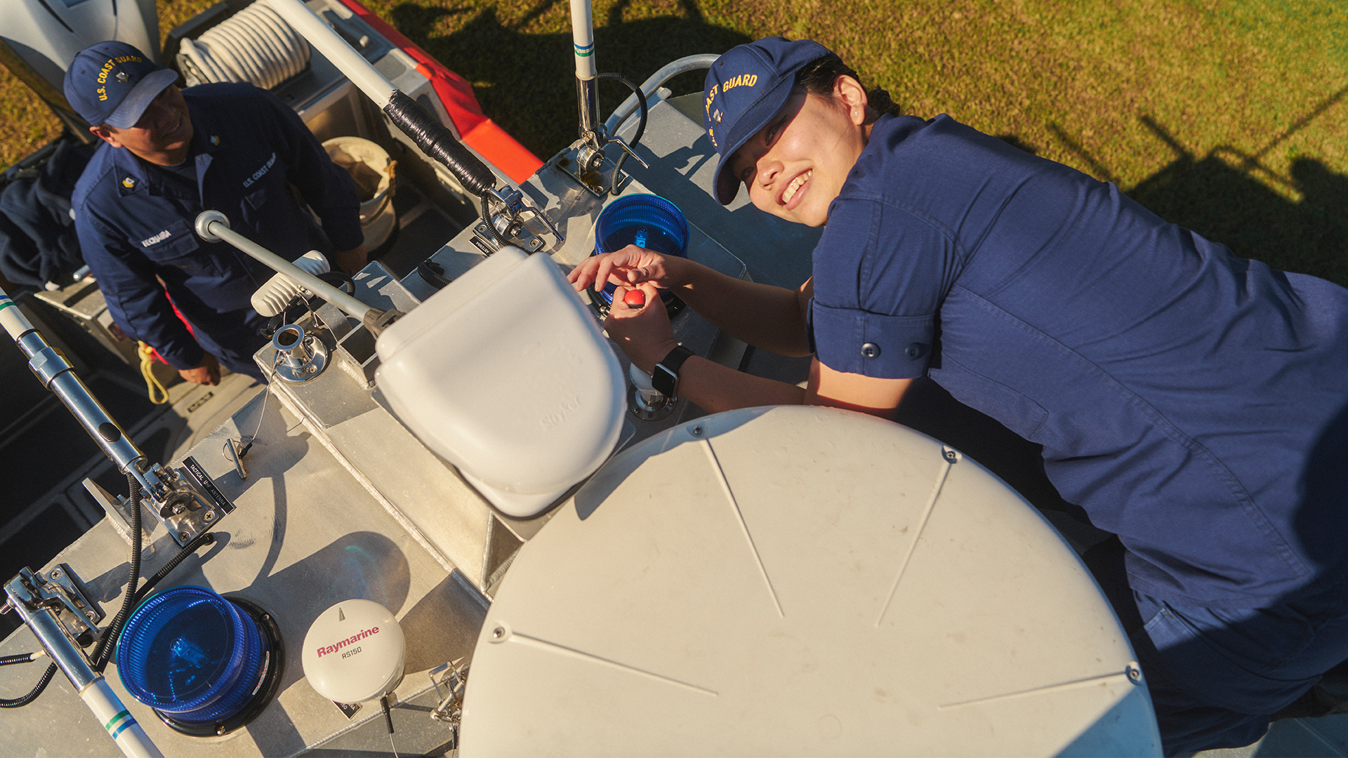 Aeint Lin laying on top of a boat