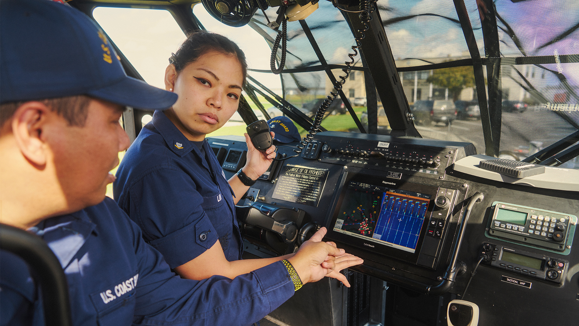 Aeint Lin talking to a coworker