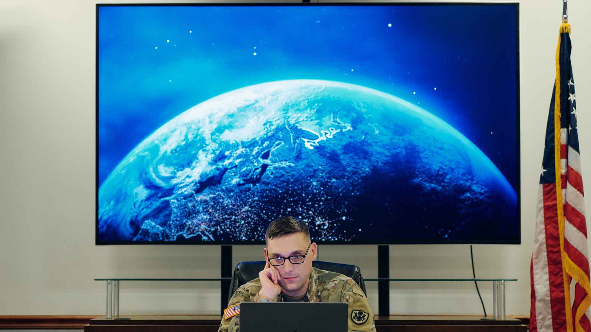 Justin Ciecierski sitting in a conference room. 