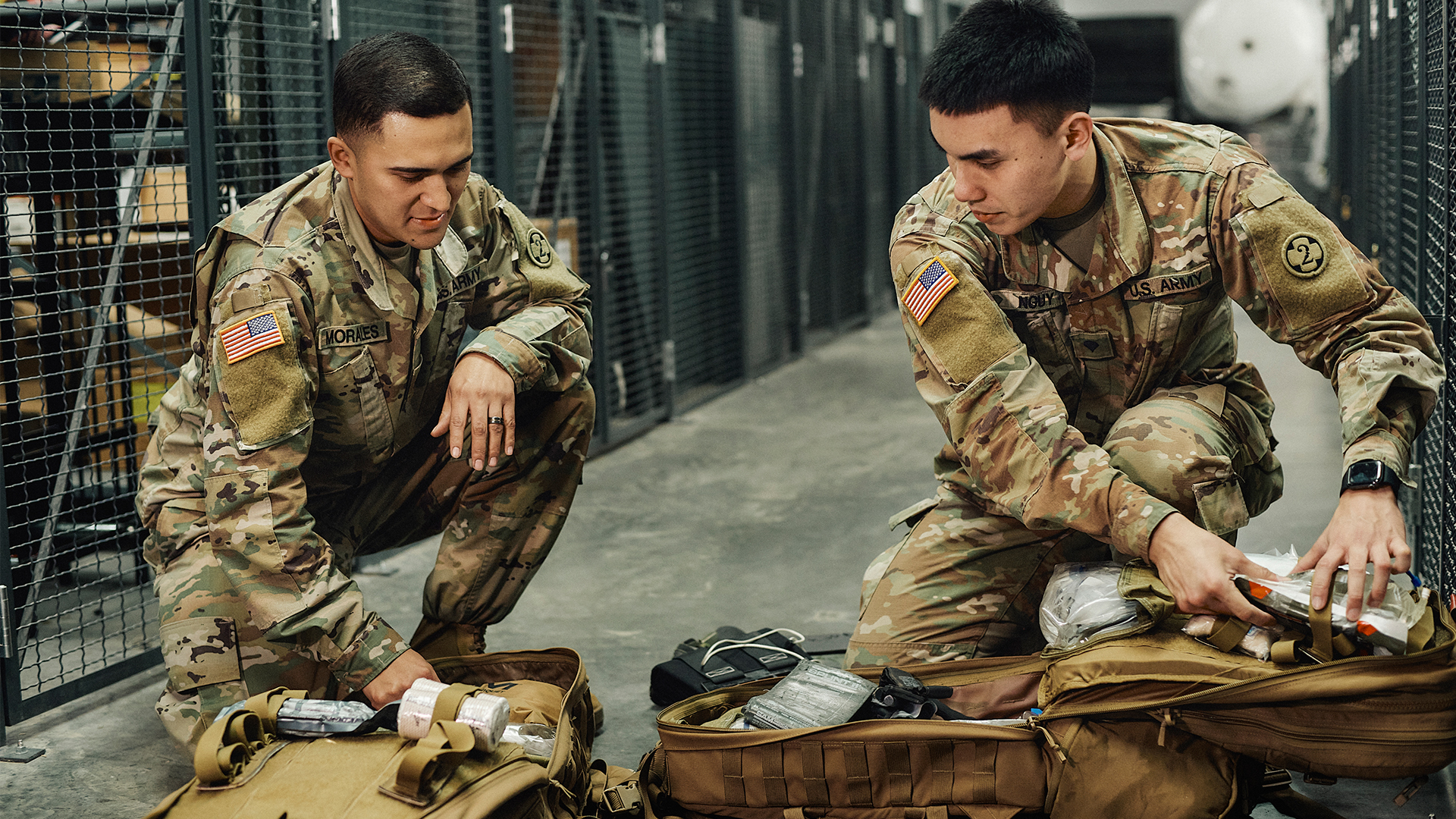 Alex and another coworker checking supplies