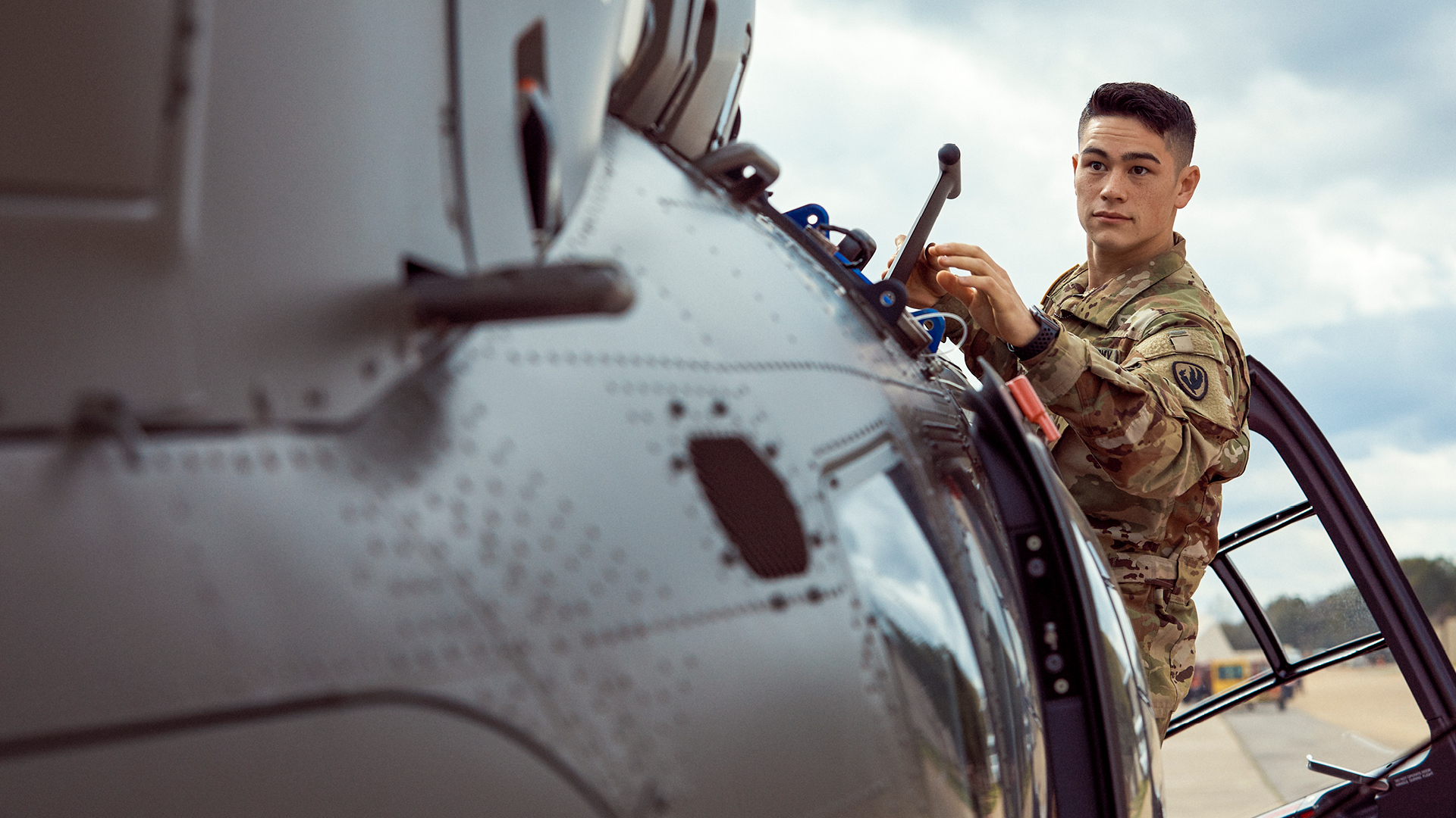 David Toguchi working on a helicopter