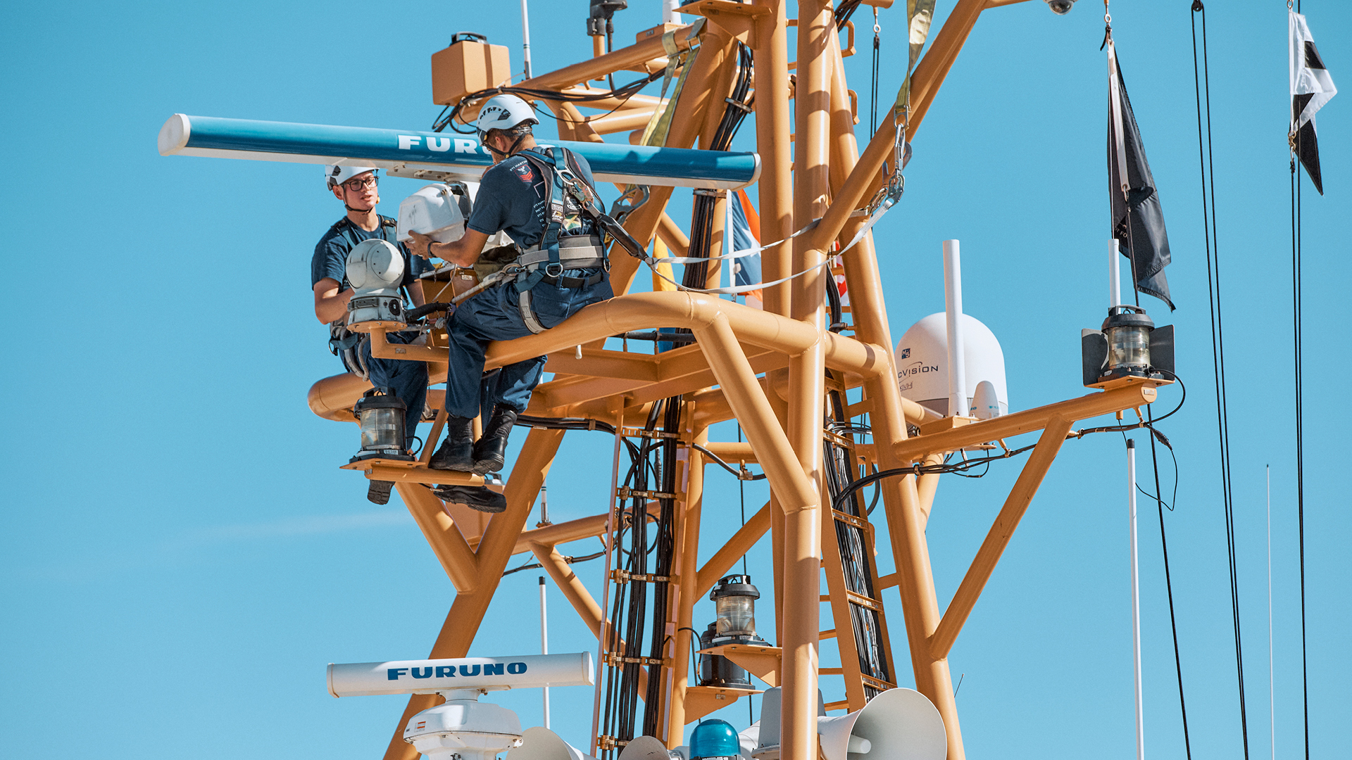 Adrian Vaszquez working with a coworker making a repair