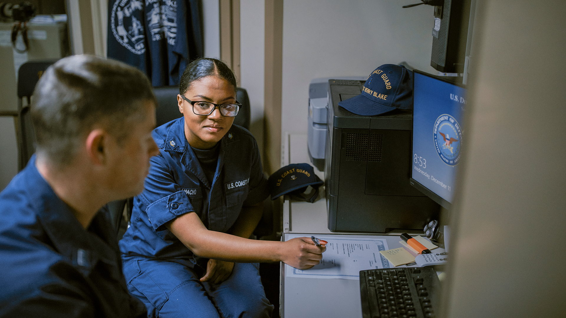 Dejanai talking to a coworker