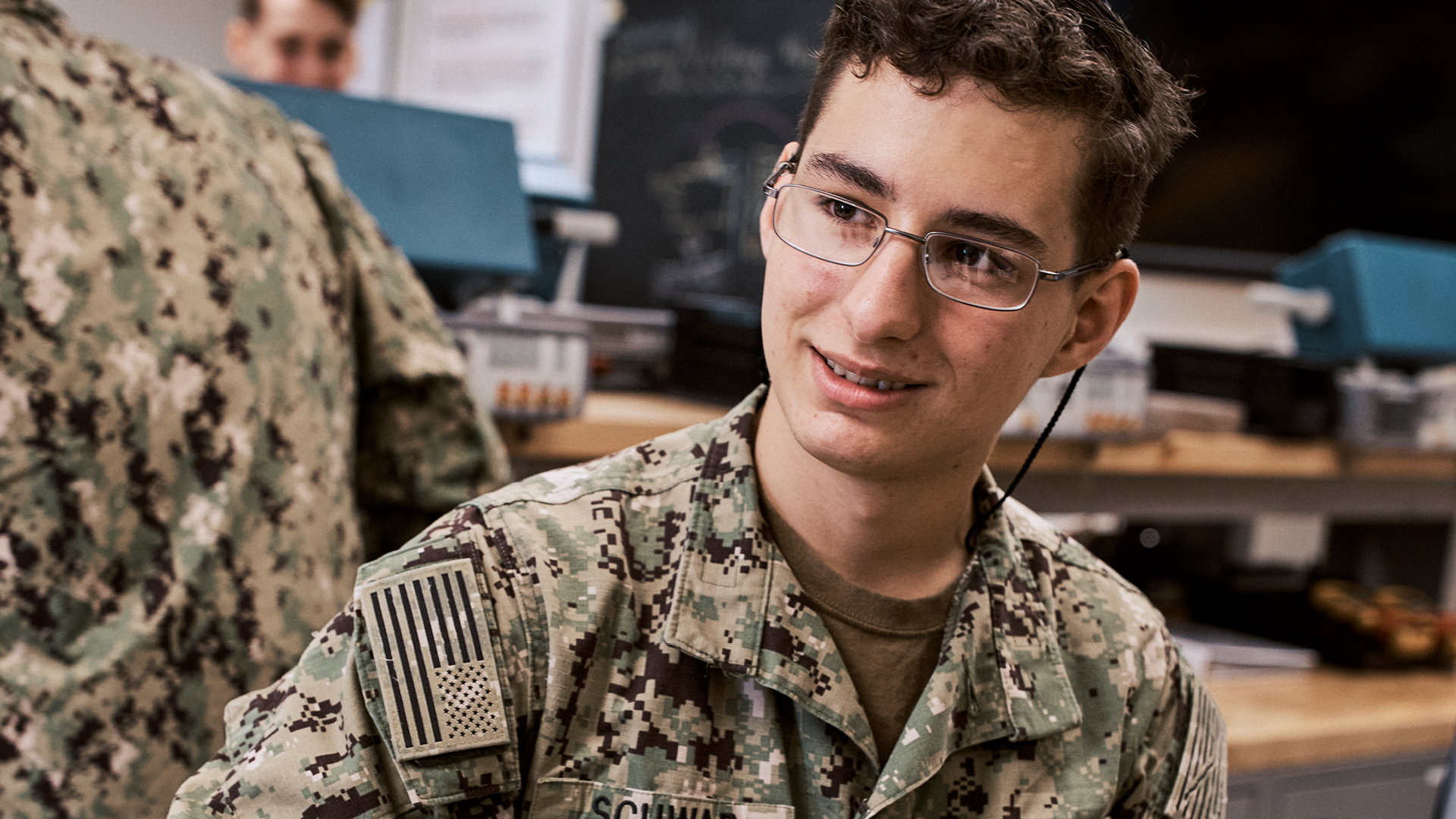 Thomas Schwab talking with a coworker