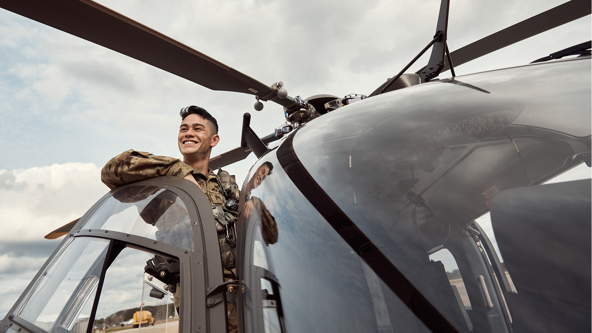 David Toguchi smiling on a helicopter
