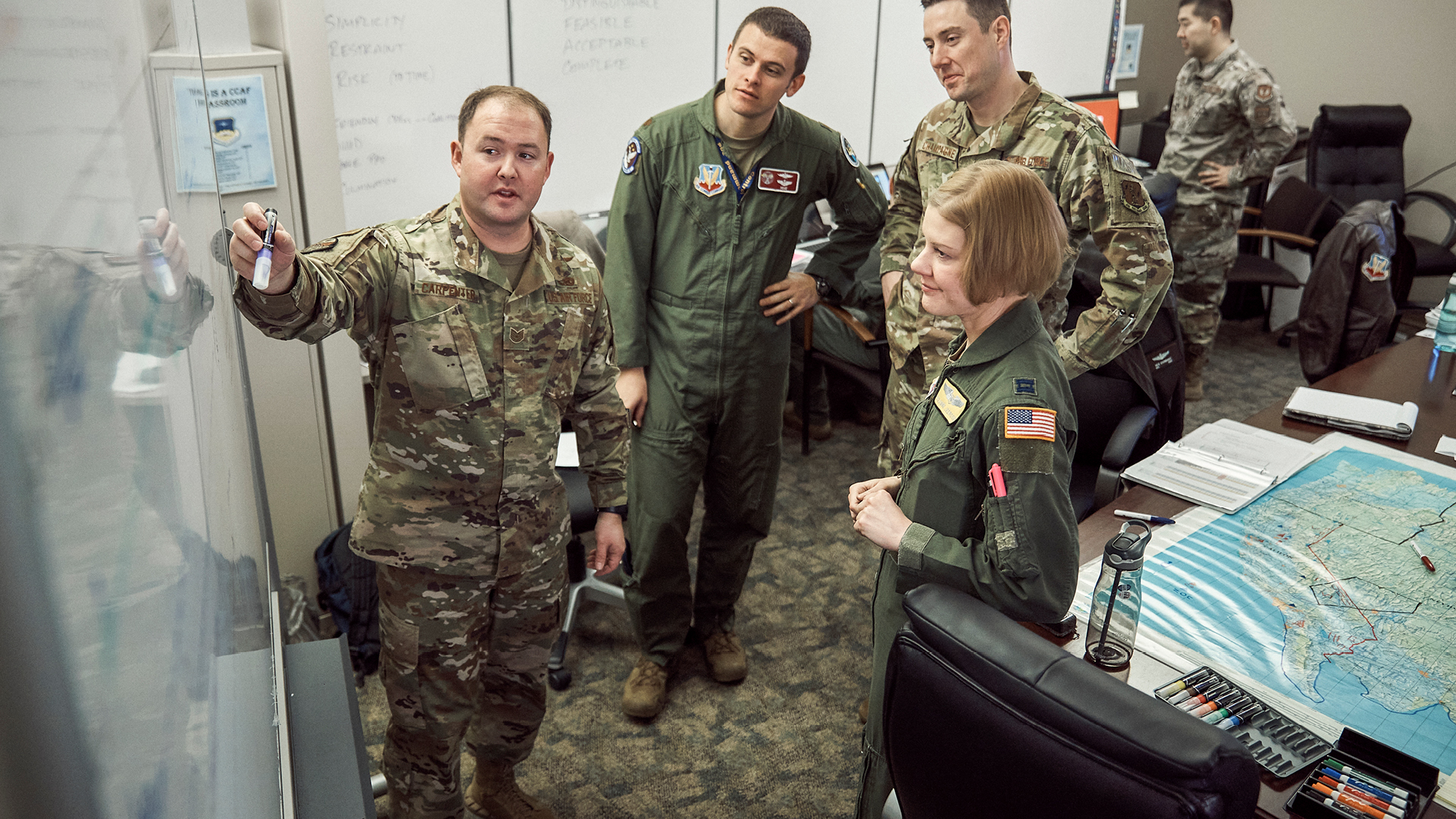 Kyle Carpenter pointing out things on a whiteboard