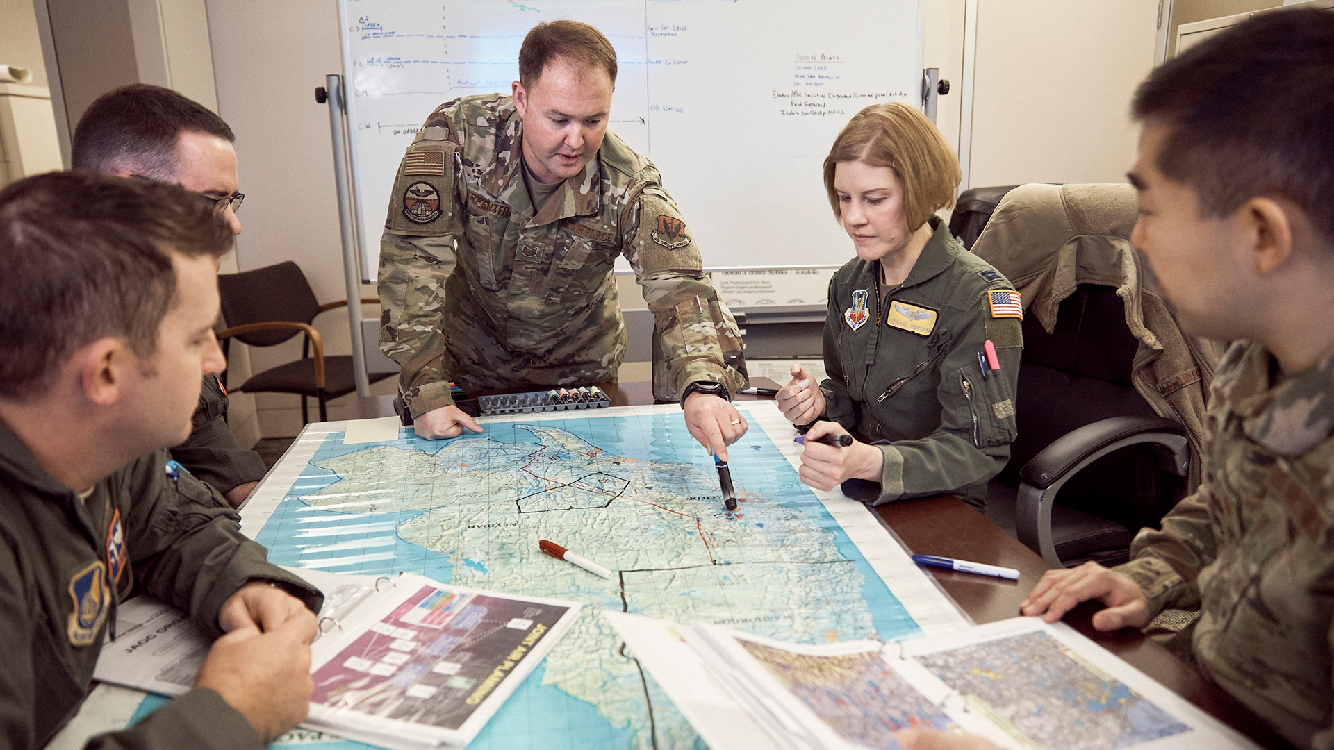 Kyle Carpenter explaining the plan to his colleagues