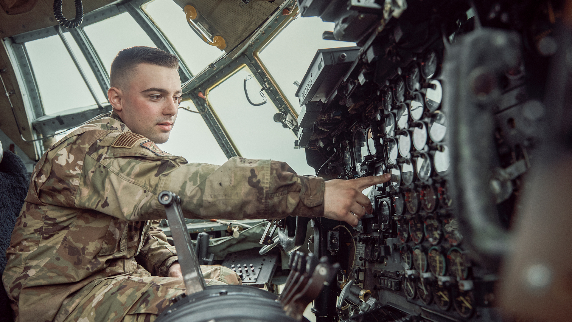 Jacob Allen maintaining an aircraft