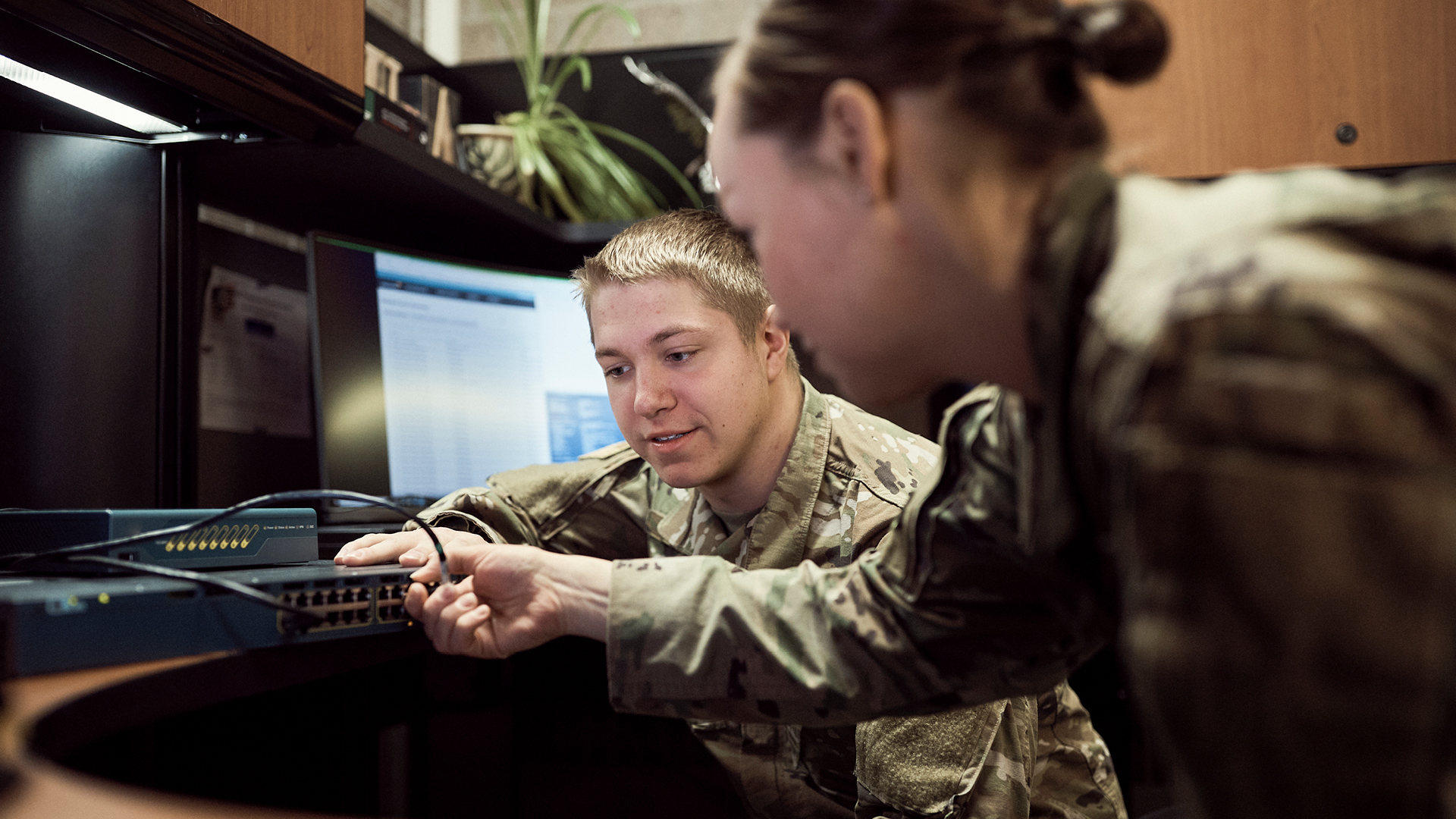 Logan Balvik helping a coworker