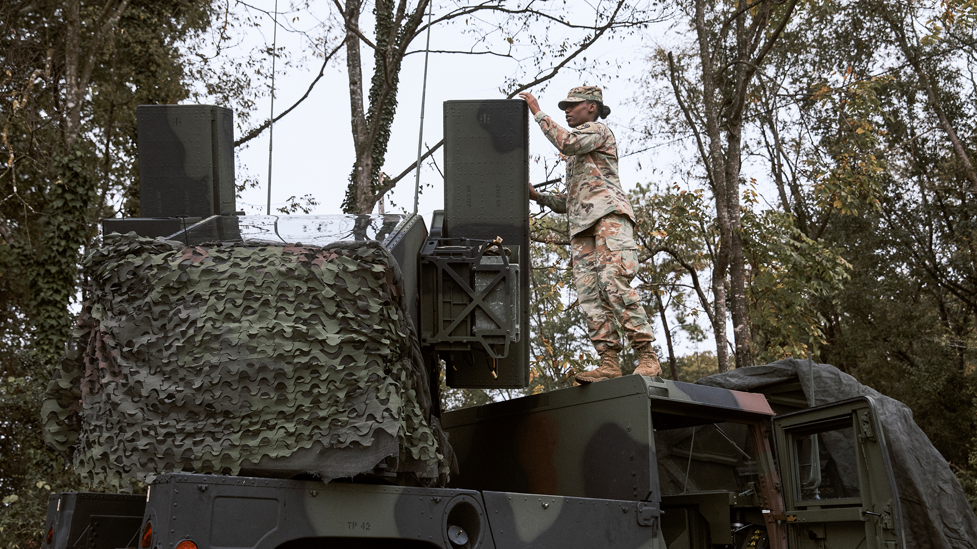 Jauntavia Prather inspecting a humvee