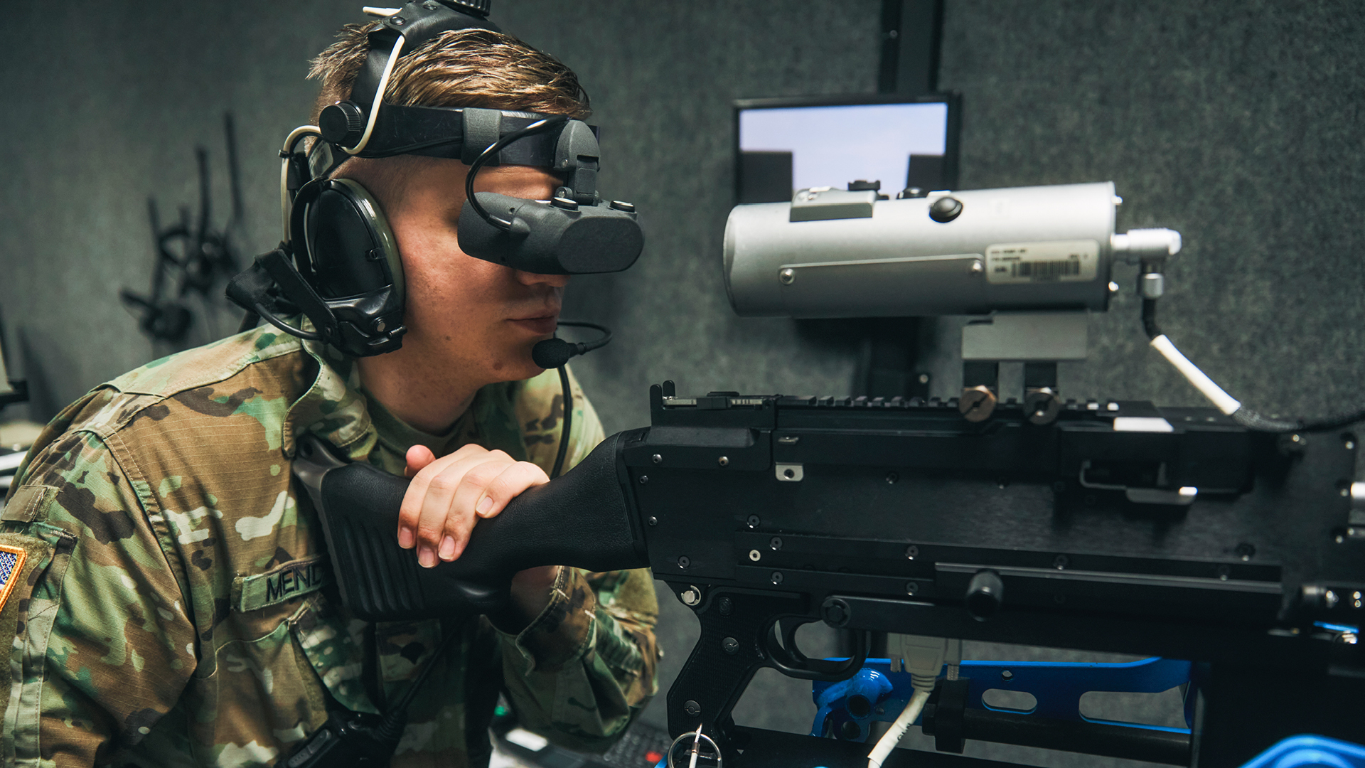 chris mendell looking through a scope