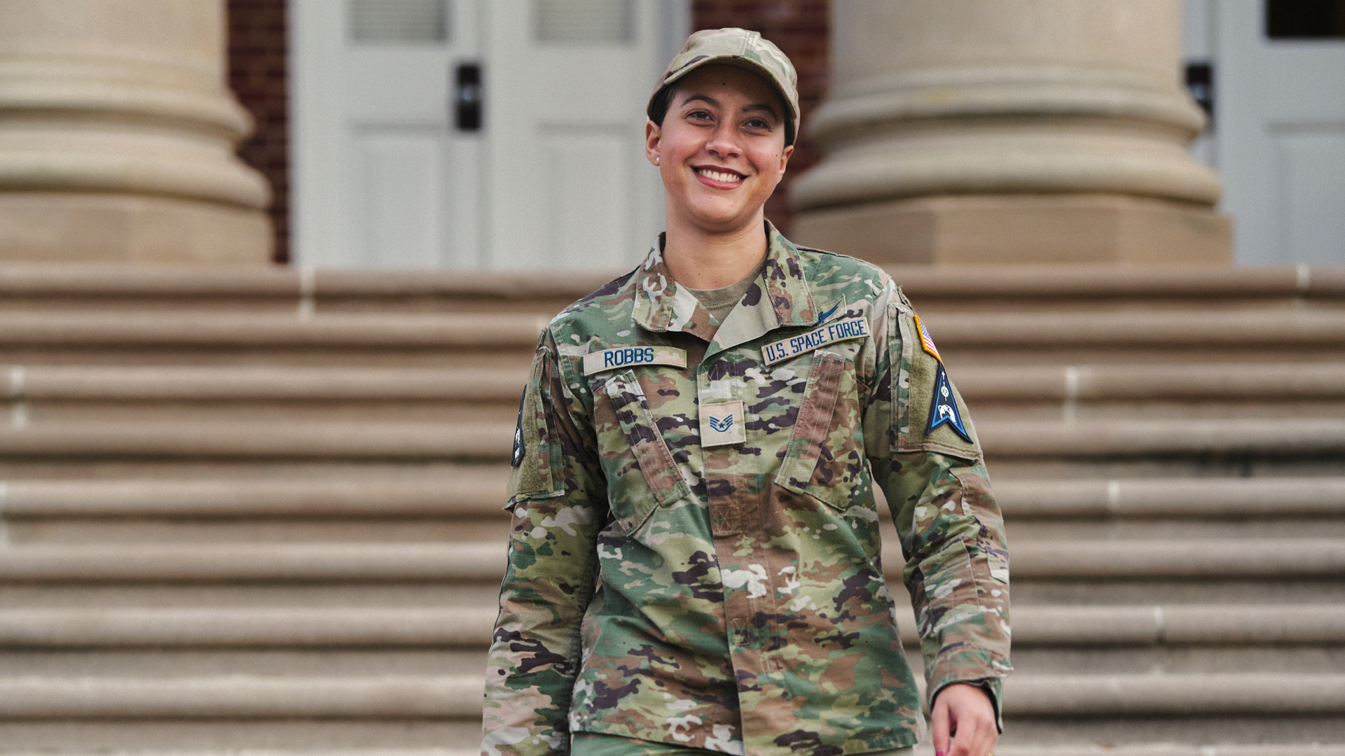 Chanel Robbs walking down the steps of a building