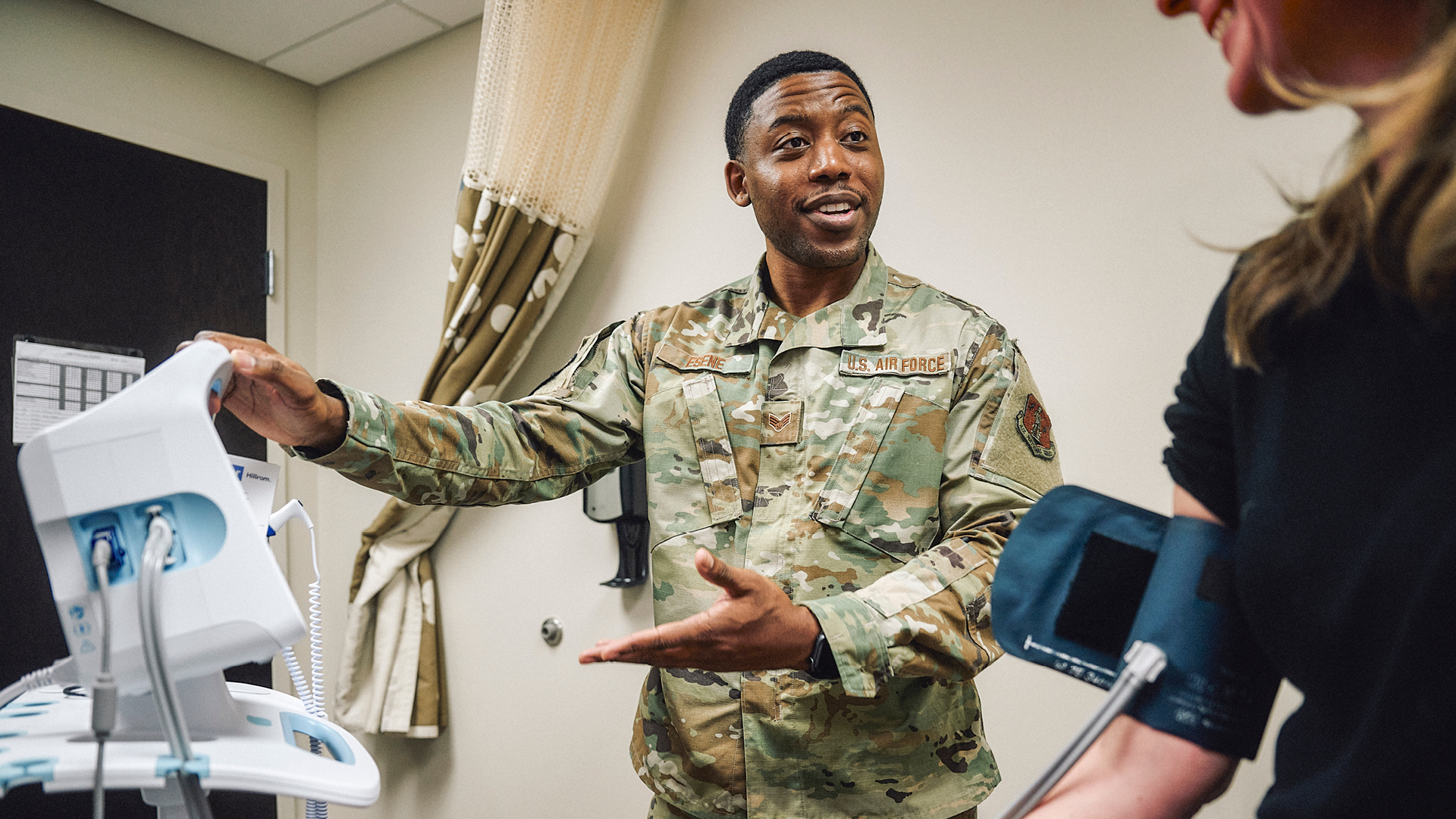 Isaac showing a patient the monitor