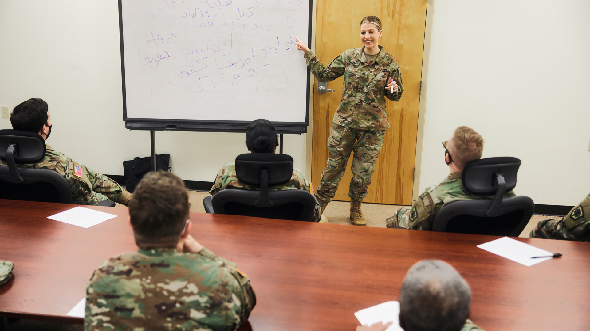 Emily Dowdell teaching using a whiteboard 