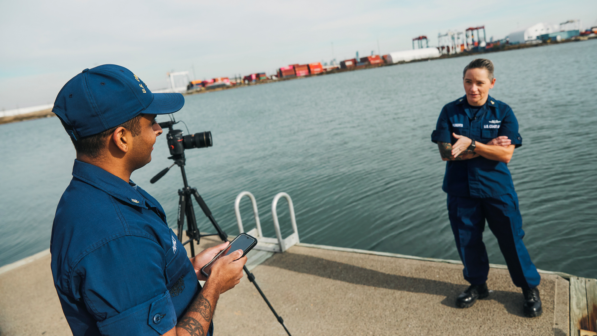 Anthony filming a coworker outside