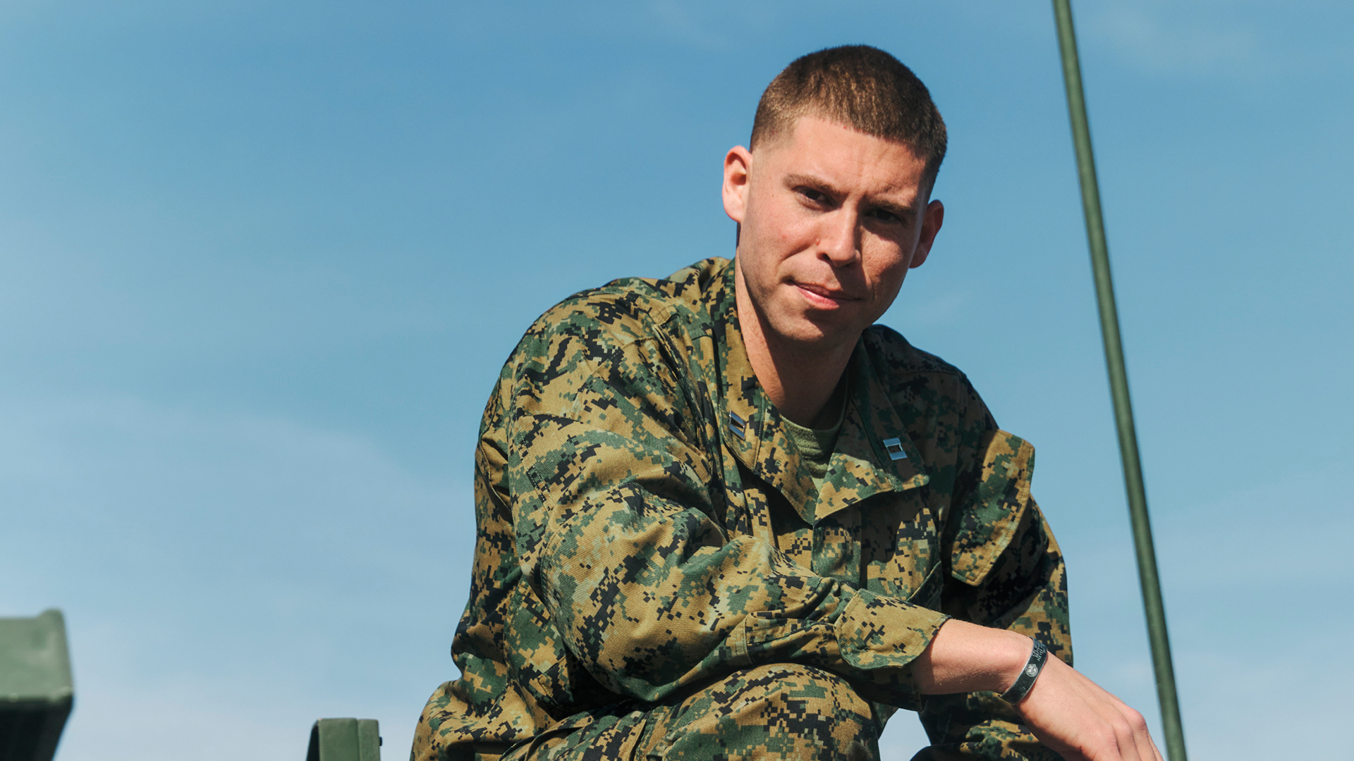 David sitting on top of a tank