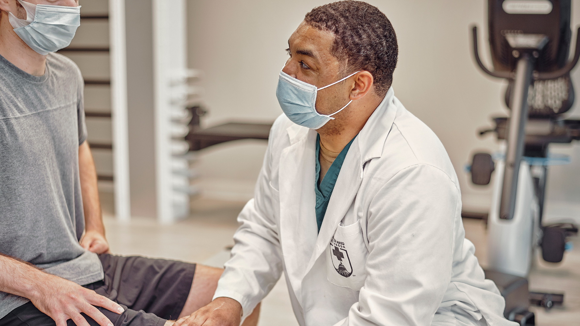 Dominique working with a patients knee