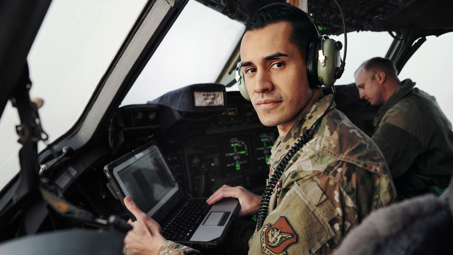 Alejandro at the seat of a plane