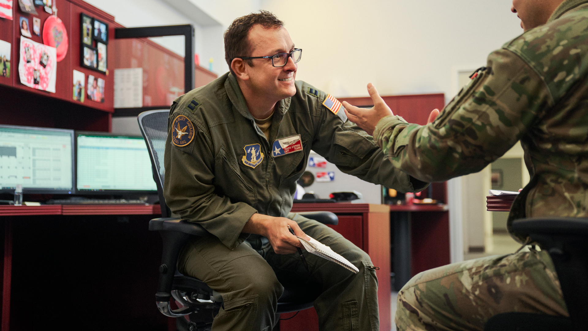 Travis Stephan shaking the hand of a coworker