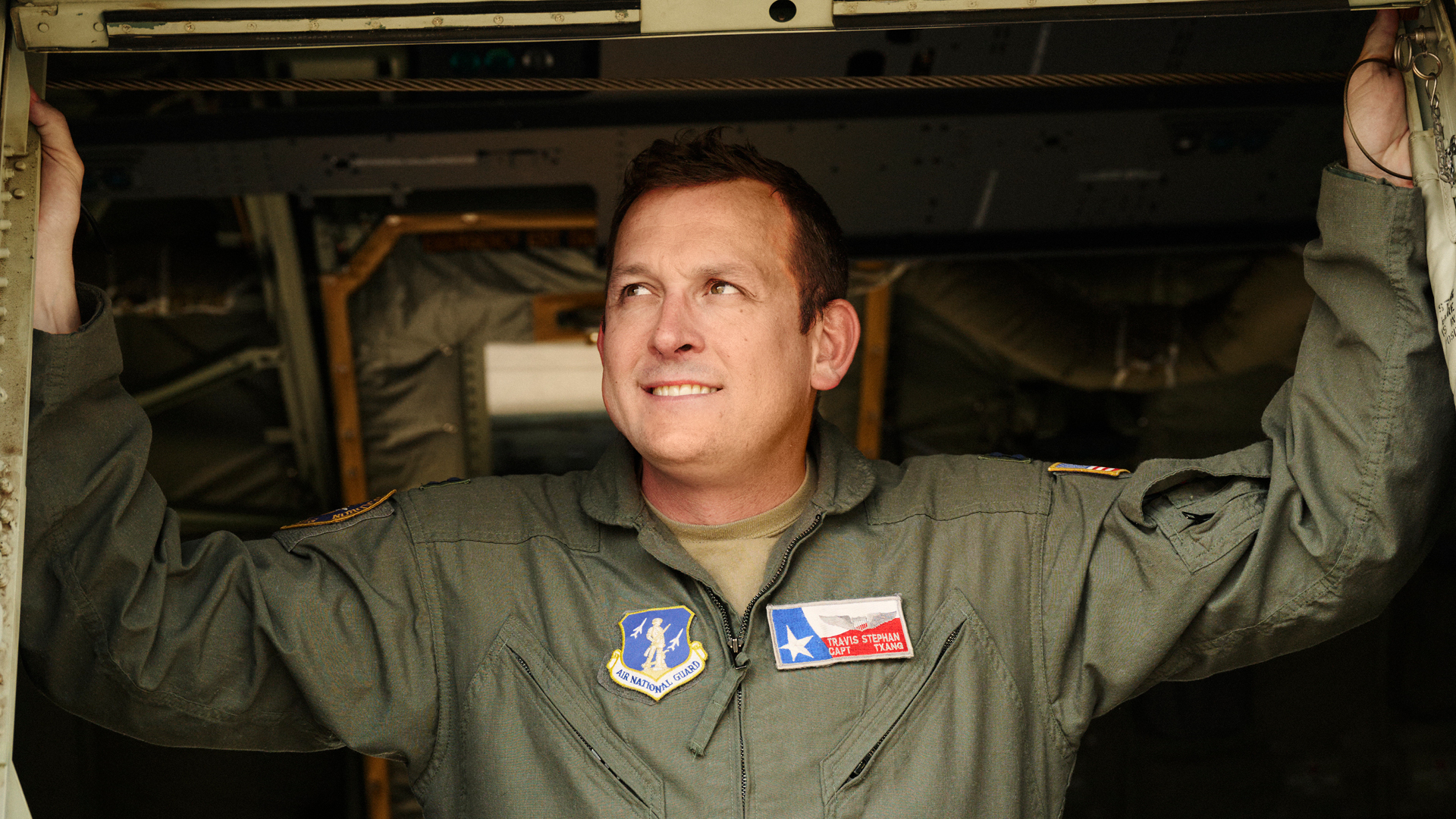 Travis Stephan looking outside of hanger door