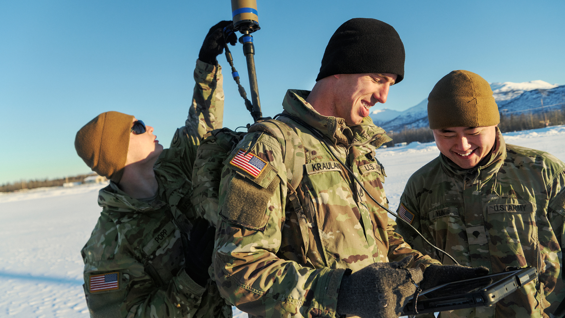 Adam Krauland working with two other coworkers