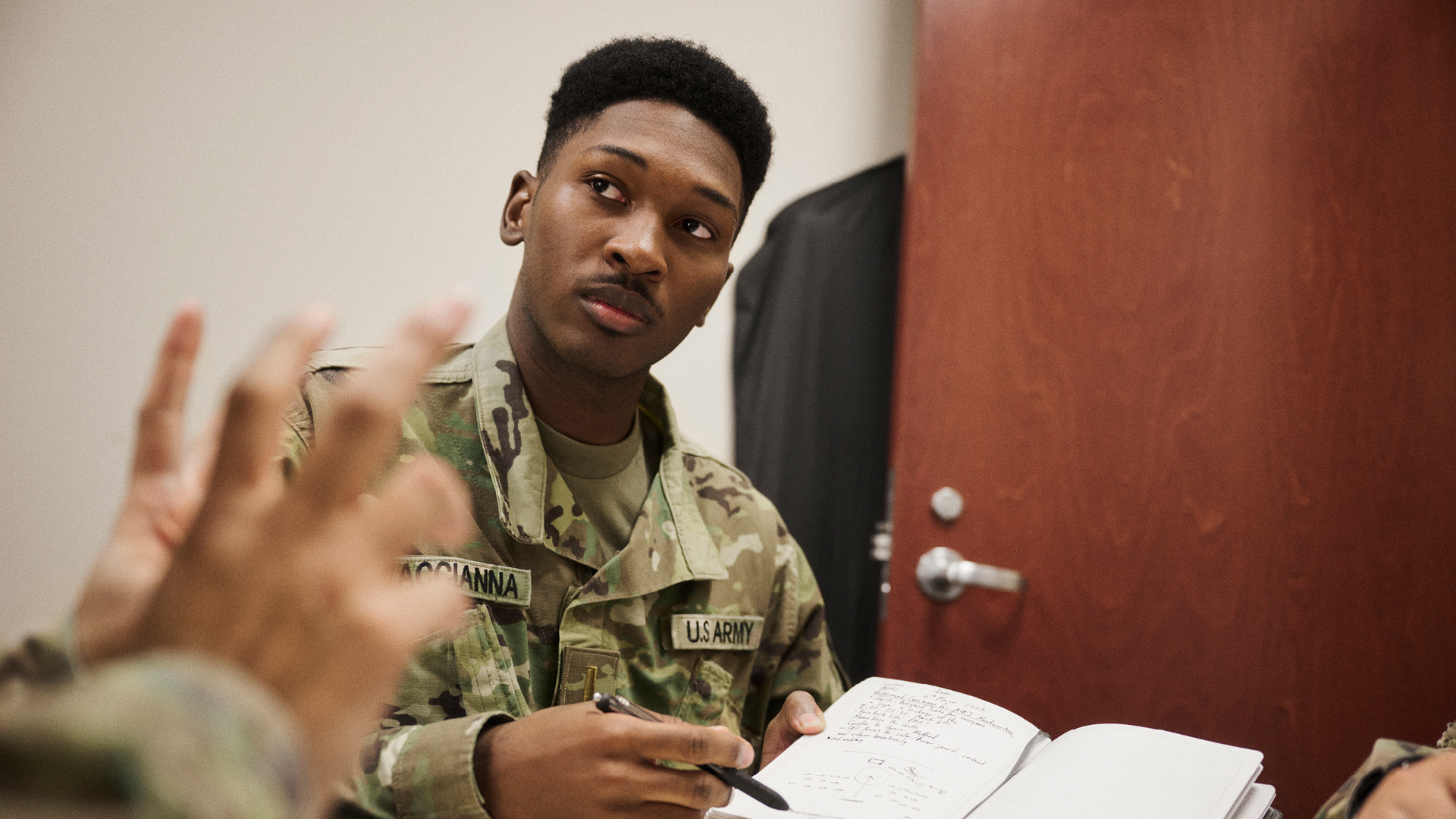 Joshua Vaccianna pointing out his notes