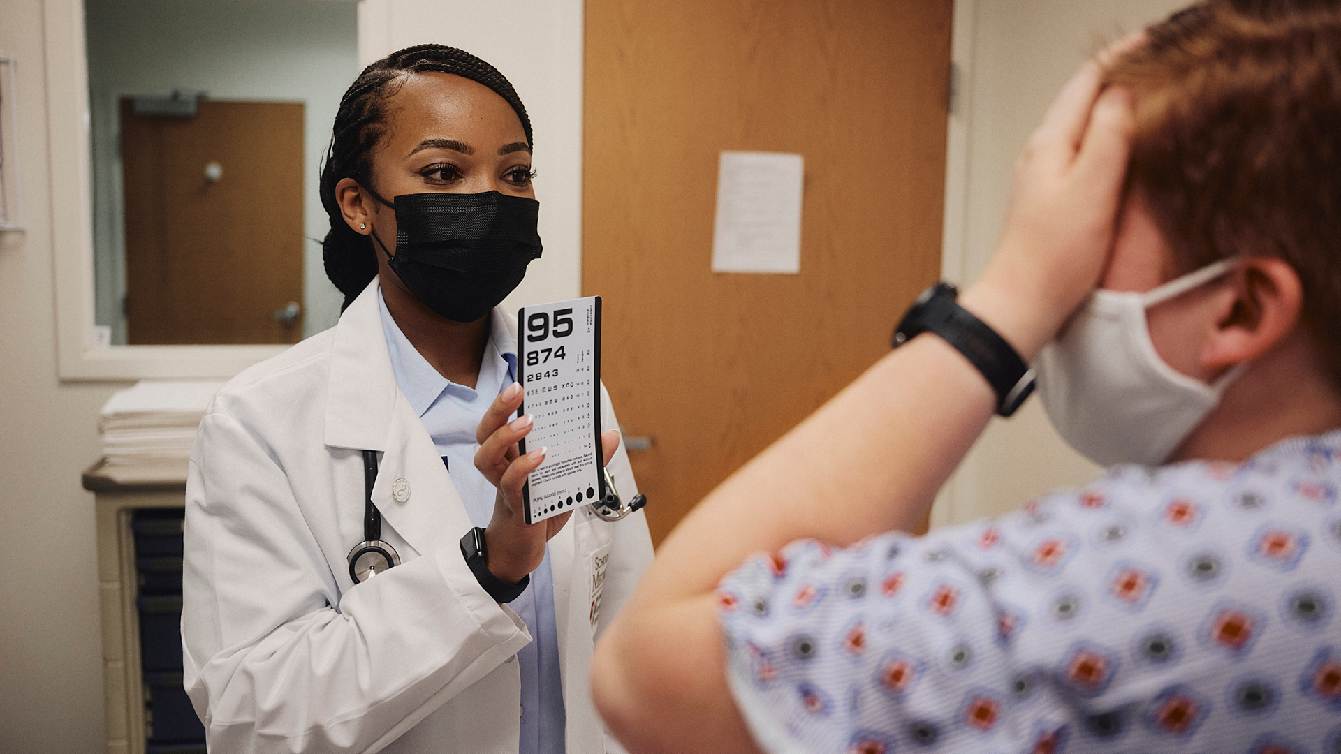Brittany working with a patient again