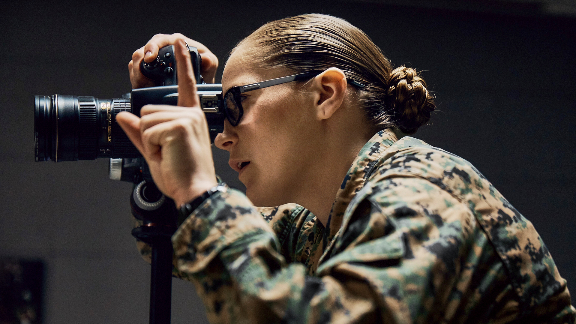 Brooke using her camera with her finger pointed up