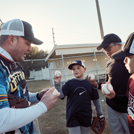 Kyle coaching baseball