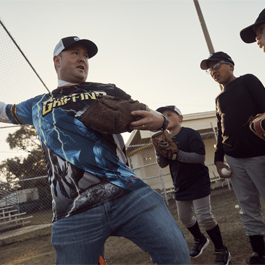 Kyle coaching baseball throwing
