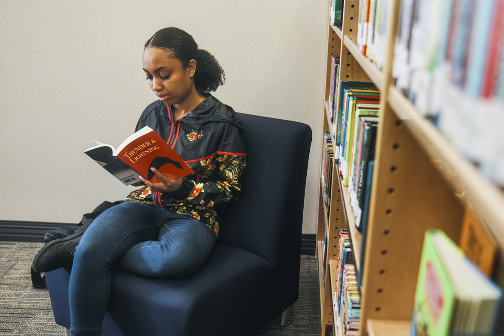 Juntranek Powell reading in the library