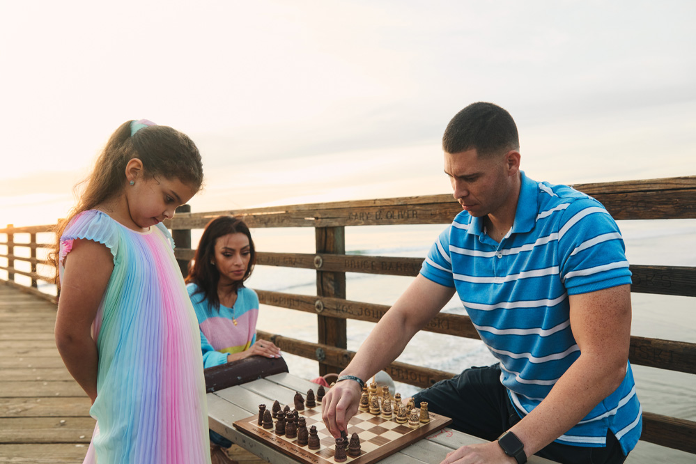 David with his family playing Chess
