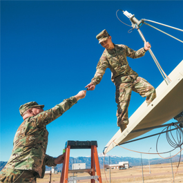 Trenton working with a another Service Member