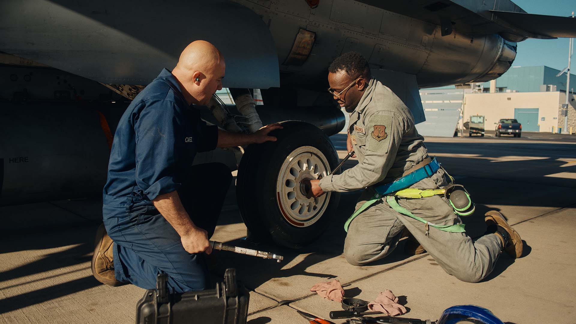 Daviyd “Rex” Hearn fixing a plane with another service member