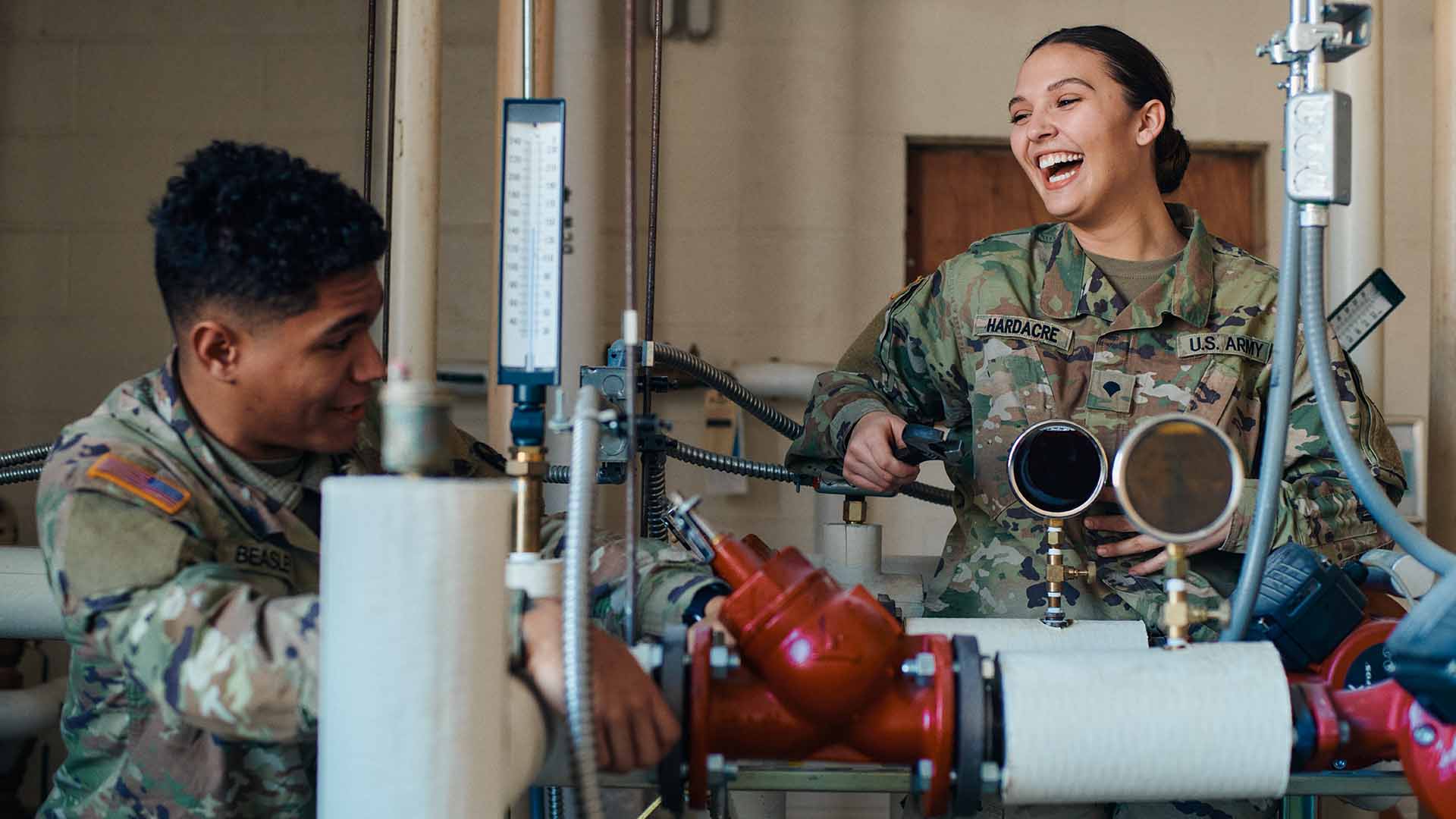 Rebekah laughing and chatting up a service member at work