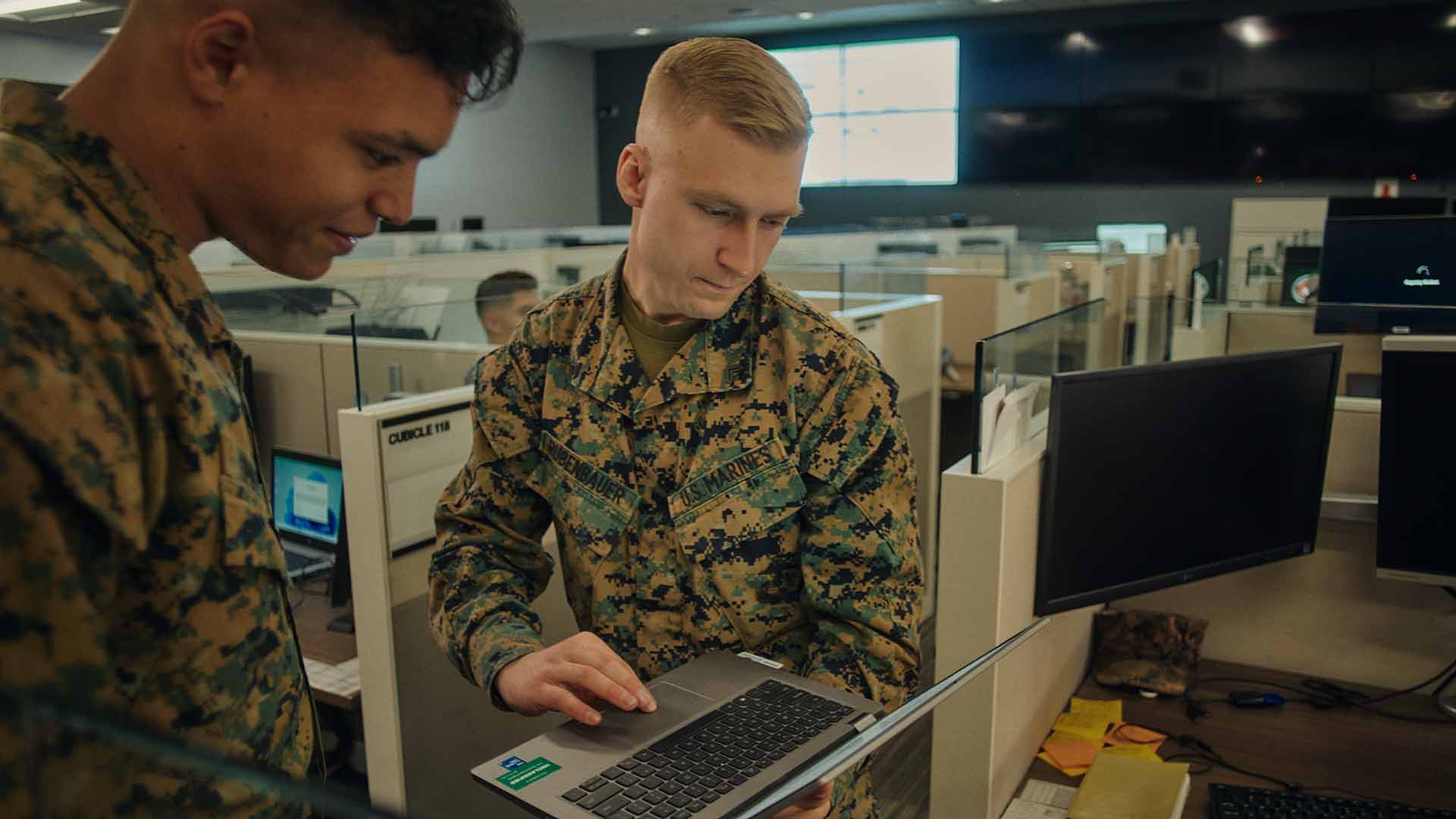 Ethan Rubenbauer showing a servicer member his computer screen