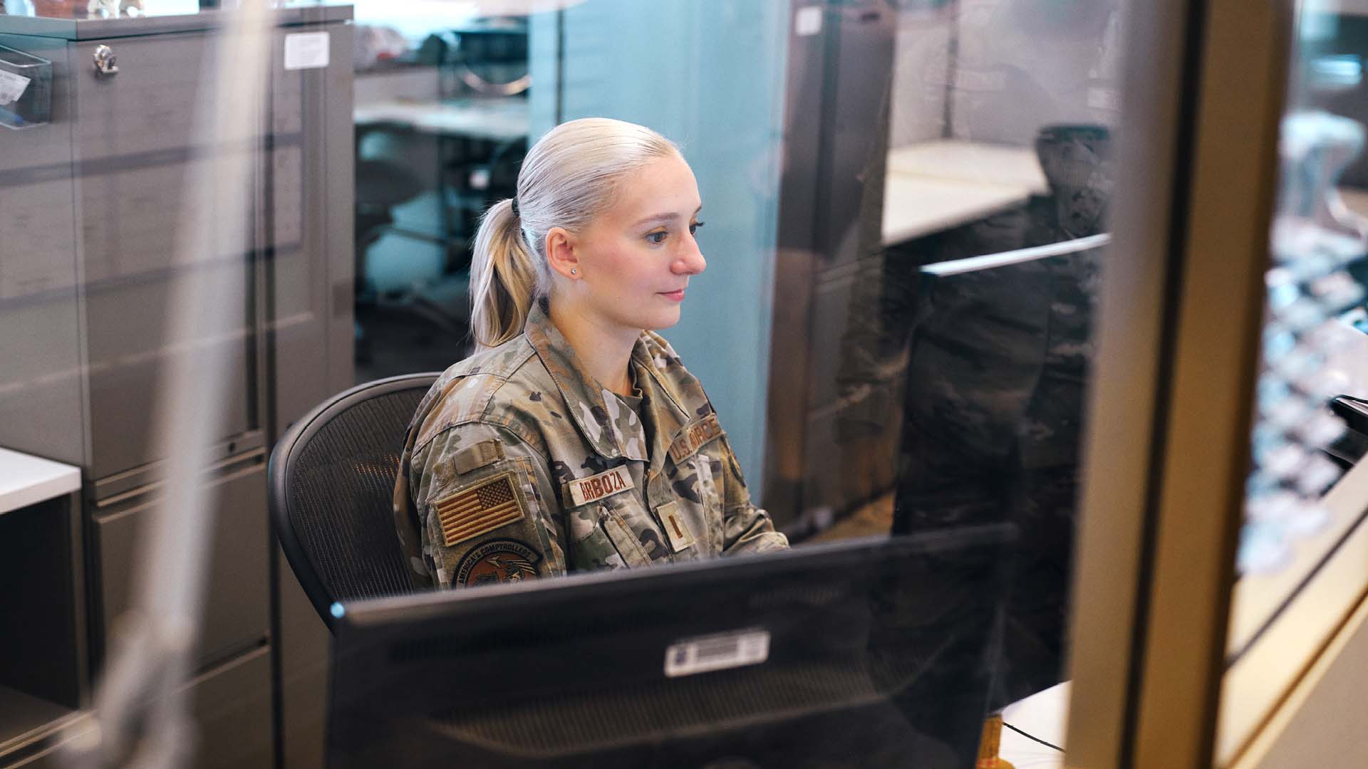 Hope Barboza sitting at a desk in an office