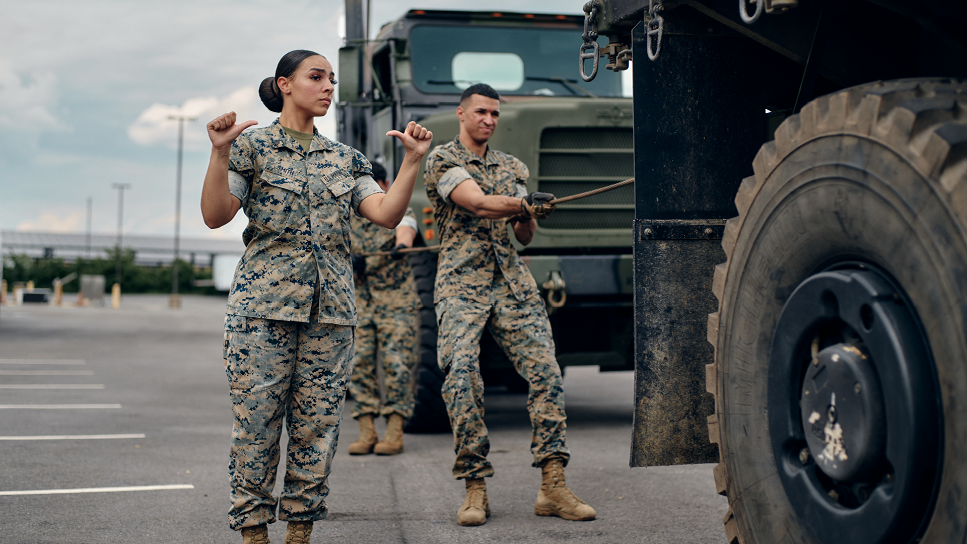 Kendyl Smith directing a tactical truck winch operation with hand signals.
