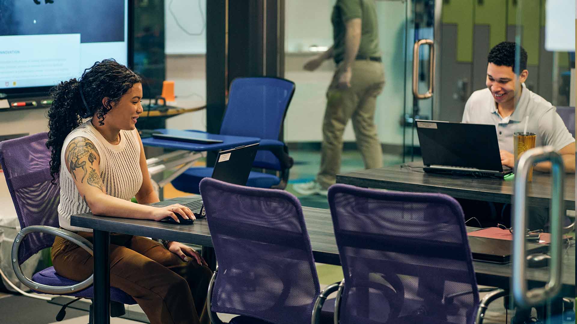 Kyla Bruno in a conference room with coworkers.