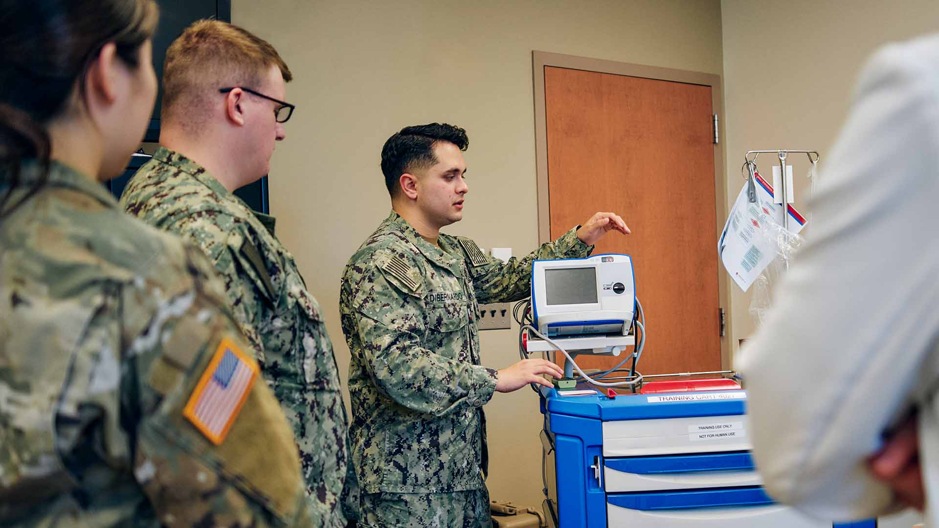 Marcus Di Bernardo demonstrating how to utilize a machine.