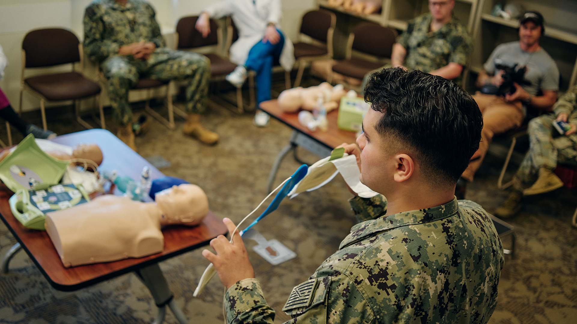 Marcus Di Bernardo training other service members.